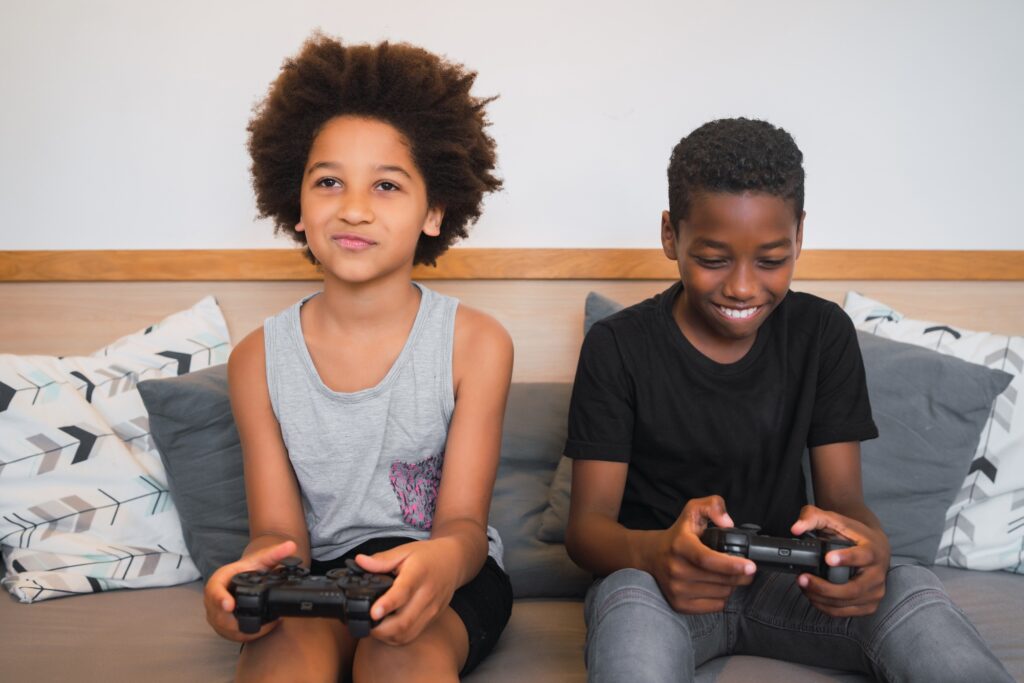 Two brothers playing video games at home.